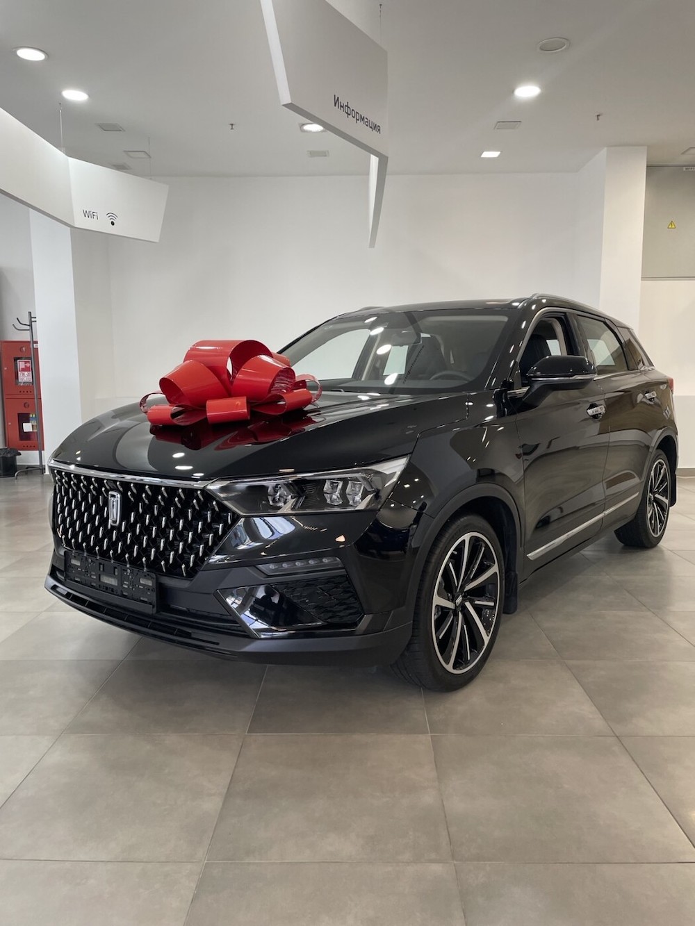 Aвтомобиль марки FAW Bestune T77. Фото: av.by.